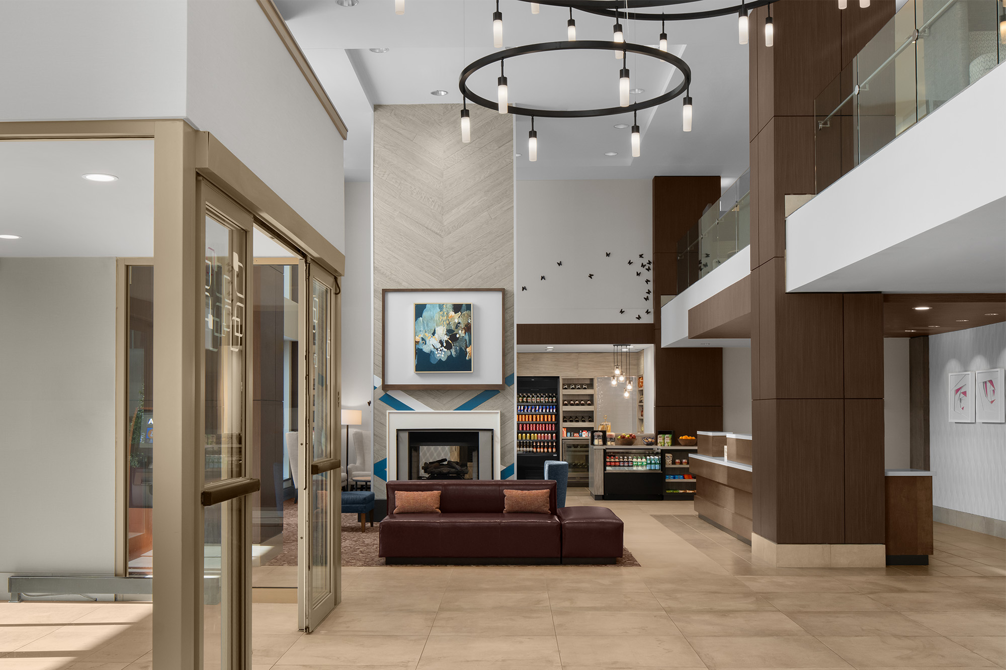 a room with a couch and a fireplace