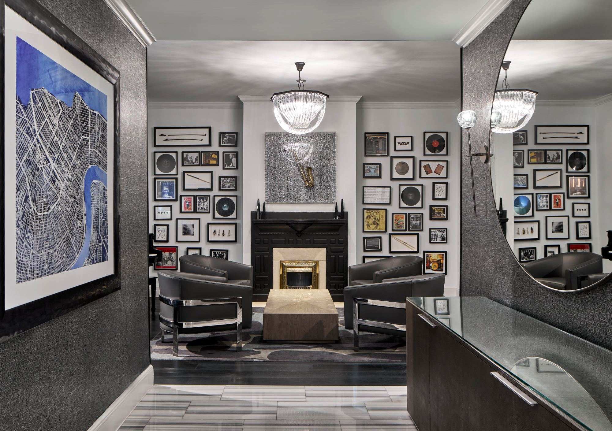 a room with a fireplace and art on the wall