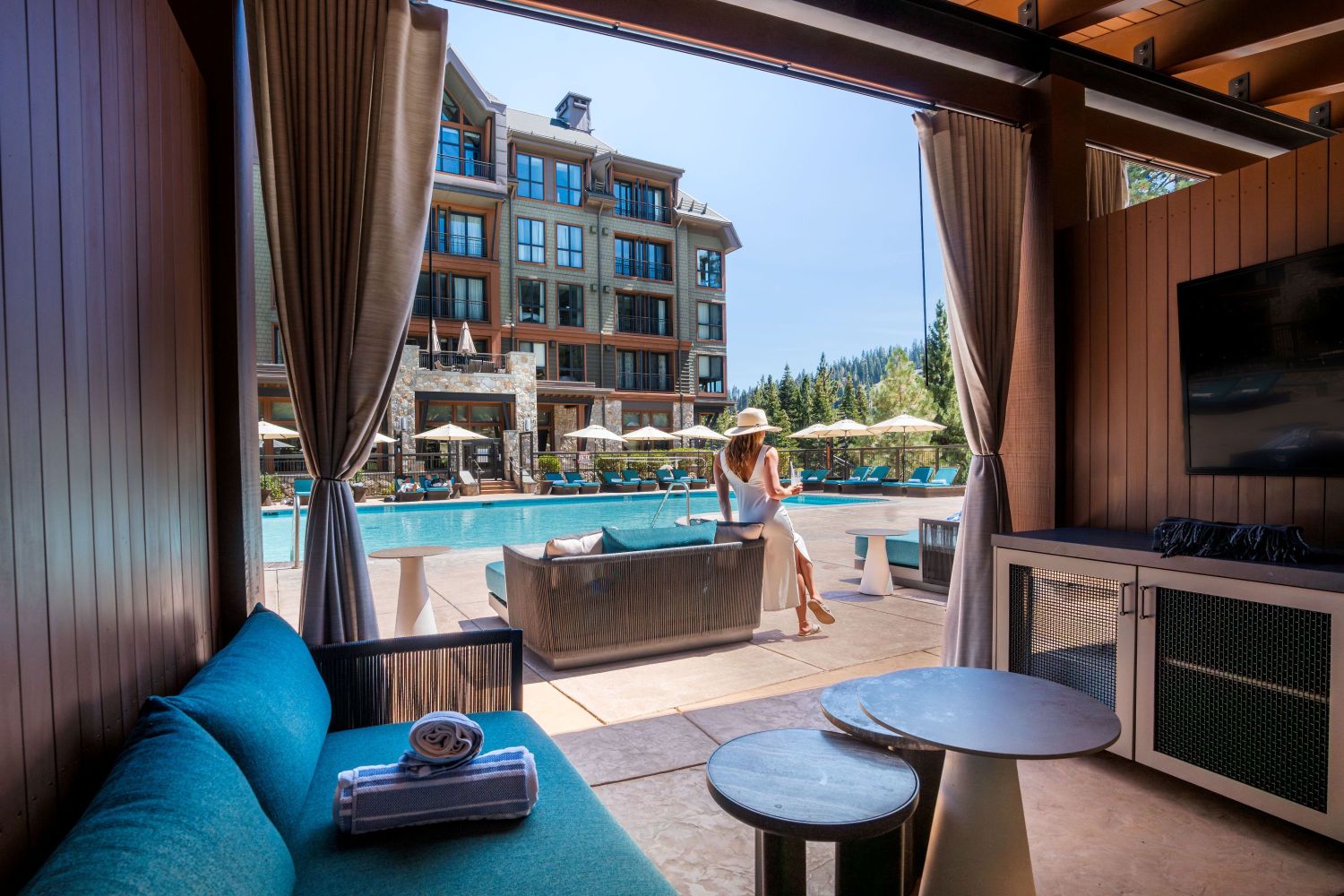 The pool cabanas at The Ritz-Carlton, Lake Tahoe; a pool deck with interior design by Premier